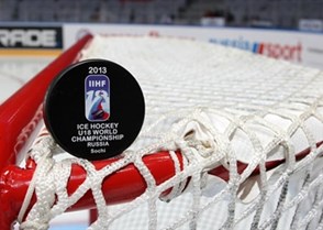 SOCHI, RUSSIA - APRIL 26: The Offiicial Game Puck of the 2013 IIHF Ice Hockey U18 World Championship sits on top the goal prior semifinal round action between Canada and Finland. (Photo by Francois Laplante/HHOF-IIHF Images)